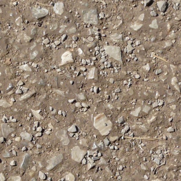Seamless ground texture containing stones of various sizes set in dark brown dirt.